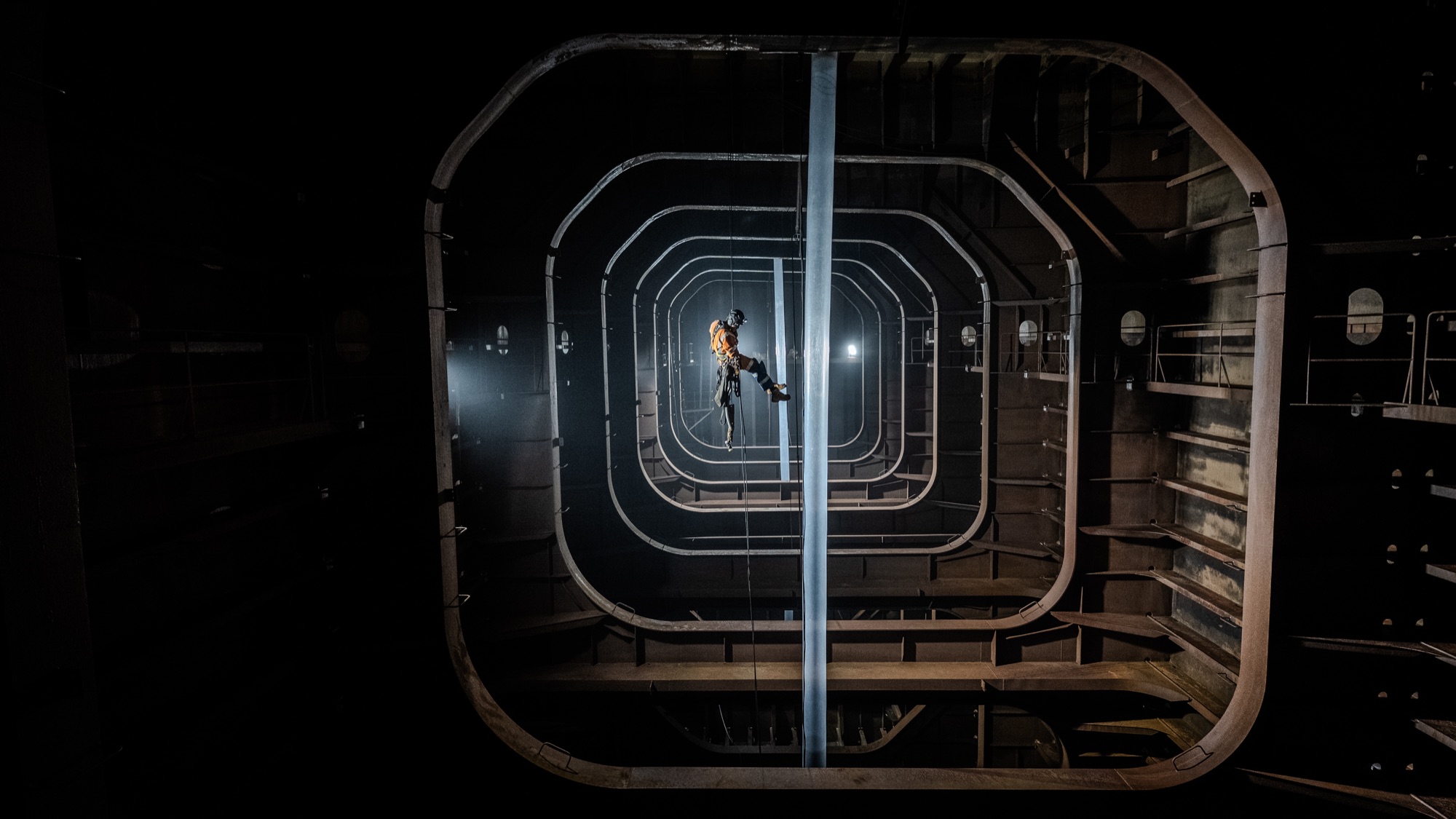 Interior of a ribbed steel water-ballast tank during inspection